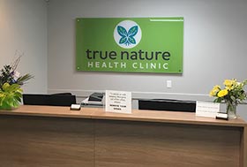 True Nature Health Clinic inside office sign at reception